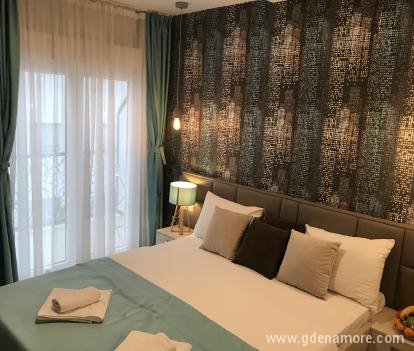 White apartments, private accommodation in city Igalo, Montenegro